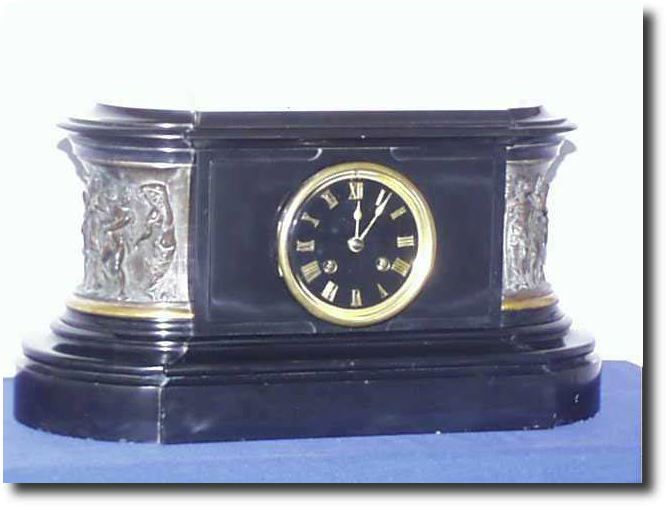 Oval French Marble with bronze figural panels., circa 1890's — Antique Clocks Price Guide