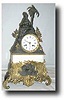 French Figural clock with White Marble and cast brass base, c. 1865