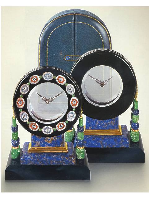 Mystery clock, whose form and decoration are inspired by the Aztec Sun Stone, in original leather fitted box. Black, Starr &amp; Frost, New York, made by Rubel Freres, Paris, circa 1920. — Antique Clocks Price Guide