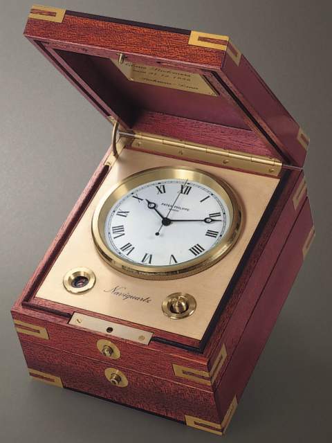 "Naviquartz III", mahogany electronic chronometer with center-seconds with original box, certificate and instruction manual. Patek Philippe &amp; Cie., circa 1985. — Antique Clocks Price Guide