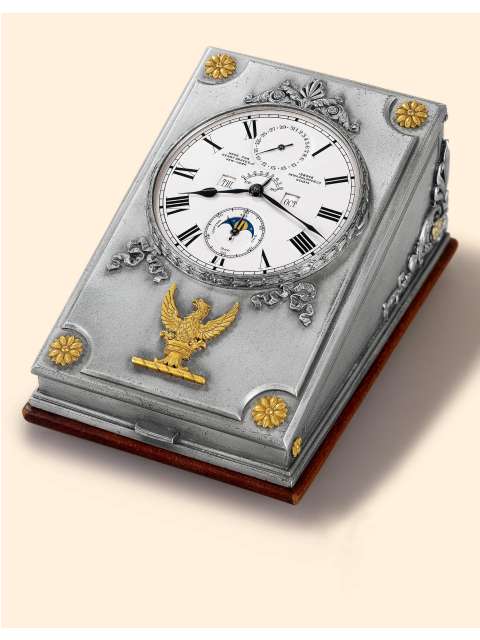 Exceptional, one of only two known, astronomical double barrel, eight day going large silver desk clock with perpetual calendar, phases of the moon and eight day power reserve indicator, accompanied by two original silver/gold/steel keys and matching calendar adjustment pin. Patek Philippe &amp; Cie., Geneve, made in 1927. — Antique Clocks Price Guide