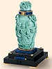 18K gold, silver, azure lacquer, lapis lazuli and black onyx desk clock in shape of an Oriental scent bottle with rotating ring hour display. Vacheron & Constantin, circa 1930.