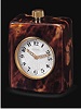 Fine tortoiseshell covered, keyless, eight day-going, quarter-repeating desk clock. Cartier, circa 1930.