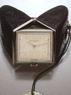 Montre de sac, stainless steel and black leather purse watch, which, when opened, becomes a little bedside clock. Rolex, 1940's. — Antique Clocks Price Guide