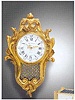 Gilt bronze solar-powered electric clock designed as a small Louis XV wall cartel. Patek Philippe & Cie. c. 1960's