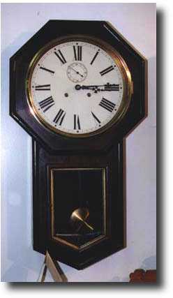 Welch "Verdi" long drop octagon wall clock — Antique Clocks Price Guide