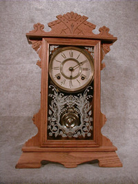 THIS AN ANSONIA OAK SHELF CLOCK THE "AMAZON". THE GLASS HAS A SILVER PATTERN. CIRCA 1895-1900. — Antique Clocks Price Guide