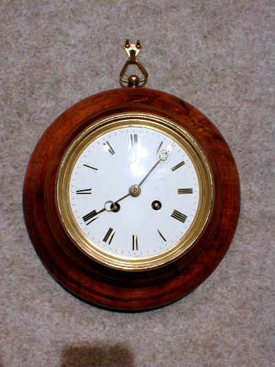THIS IS A SMALL ROUND FRENCH WALL CLOCK IN AN OAK CASE. CIRCA 1870-1890. — Antique Clocks Price Guide