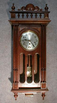 FRENCH WESTMINSTER BOX CLOCK. WALNUT CASE WITH WIDOWS WALK TOP AND CARVED TOP PIECE. CIRCA 1910-20. — Antique Clocks Price Guide