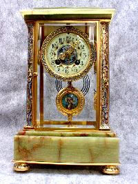 THIS IS A FRENCH CRYSTAL REGULATOR IN A GOLD PLATED CASE WITH CHAMPLEVE ENAMEL INLAYS. CIRCA 1900. — Antique Clocks Price Guide