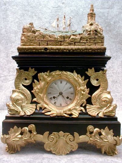 THIS IS A FRENCH AUTOMATON ROCKING SHIP MANTEL CLOCK IN AN EBONISED WOOD CASE. CIRCA 1810-1825. — Antique Clocks Price Guide