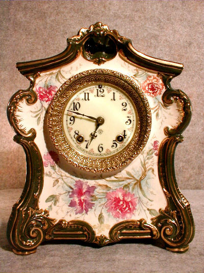 ROYAL BONN PORCELAIN MANTEL CLOCK "LA DON", BY THE ANSONIA CLOCK CO. CIRCA 1900-10. — Antique Clocks Price Guide