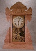 SESSIONS PRESSED OAK SHELF CLOCK.CIRCA 1900-1920.