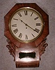 THIS IS A 8 DAY ENGLISH DROP DIAL CHAIN FUSEE TIMEPIECE IN A MAHOGANY CASE WITH BRASS INLAY. CIRCA 1900-1910.