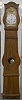 MORBIER FLOOR CLOCK IN A VIOLIN SHAPED CASE OF SPRUCE WOOD PAINTED IN A ORIGINAL FAUX GRAINED WOOD FINISH. CIRCA 1830-1850.
