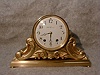 SETH THOMAS METAL TAMBOUR "TAMPA" IN A GILT FINISH. CIRCA 1910.
