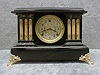 GILBERT BLACK MANTEL CLOCK "AUSTRIA" IN AN ENAMELED WOOD CASE. CIRCA 1906