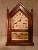 "VERMONT" STEEPLE CLOCK BY THE NEW HAVEN CLOCK CO. THE CASE IS SOFTWOOD IN A DARK FINISH. CIRCA 1930'S.