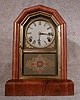 THIS IS A DORIC SHELF CLOCK, THE "COMET" BY THE GILBERT CLOCK CO.,CIRCA 1879-85.