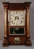 SETH THOMAS "COLUMN" MANTEL CLOCK. ROSEWOOD VENEERED CASE WITH ANTIQUED GILT COLUMNS. CIRCA 1910.