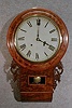 ANGLO/AMERICAN ROUND TOP, SHORT DROP WALL CLOCK. CIRCA 1870'S.