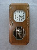 FRENCH BOX CLOCK IN A WALNUT VENEERED CASE. CIRCA 1930'S.