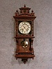 THIS IS A GERMAN DWARF BERLINER STYLE WALL CLOCK WITH A BOTTOM GALLERY. CIRCA 1900.
