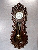 THIS IS AN AUSTRIAN SINGLE WEIGHT WALL REGULATOR IN A HEAVILY CARVED LINDENWOOD CASE. CIRCA 1862-1871.