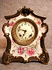 ROYAL BONN PORCELAIN MANTEL CLOCK "LA DON", BY THE ANSONIA CLOCK CO. CIRCA 1900-10.