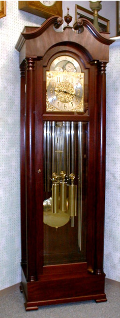 Massive Hall Clock By The Colonial Manufacturing Co., In An American Case Made Out Of Solid Mahogany With Plate Beveled Glass In The Lower Front Door, The Sides And Side Doors.  Circa 1900-1915. — Antique Clocks Price Guide