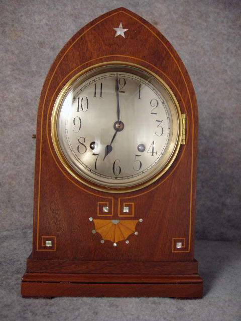 German Lancet Top Mantel Clock In A Mahogany Veneered Case With Satin Wood Banding, Marquetry And Mother Of Pearl Inlay. Circa 1900-1910. — Antique Clocks Price Guide