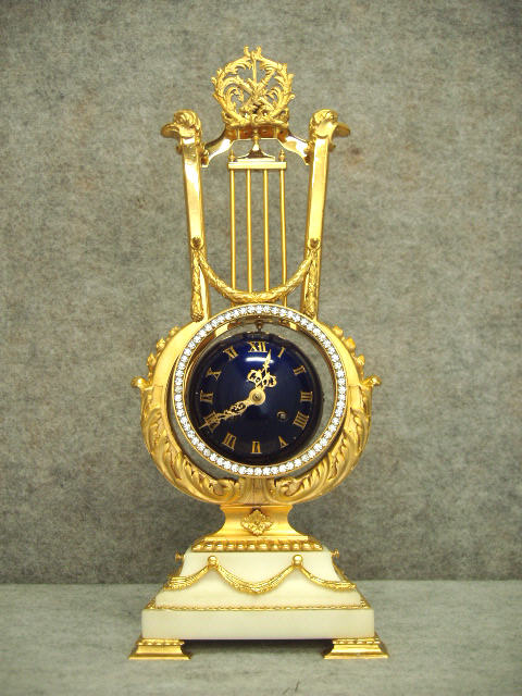 French Lyre Clock In A Gold Plated Cast Brass And White Marble Case, Circa 1890-1900. — Antique Clocks Price Guide