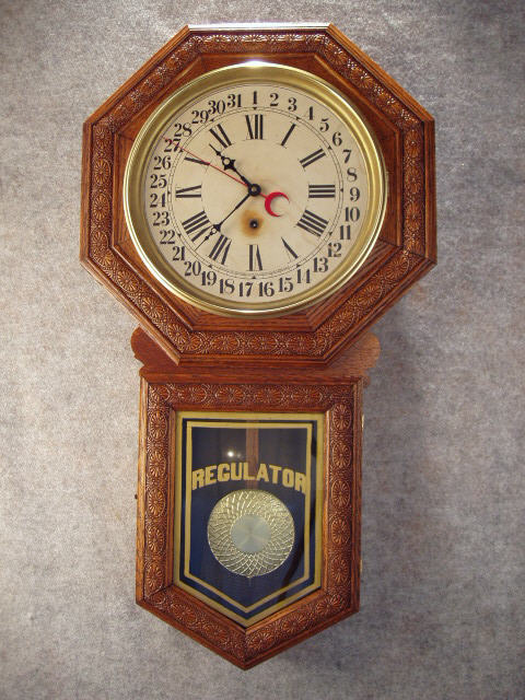 "Star Pointer" Long Drop Wall Clock In An Oak Embossed Case By The Sessions Clock Co. Circa 1908-1915. — Antique Clocks Price Guide