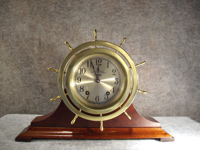 Brass Cased Spoked Bezel Ship's Clock By The Seth Thomas Clock Co On A Mahogany Stand. Circa Pre 1937. — Antique Clocks Price Guide