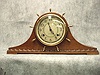 2 The Dial Is Painted And Brass With Arabic Numbers.
