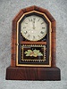 New Haven "Octagon Prize" Mantel Clock In A Rosewood Veneered Case. Circa 1878-1885
