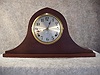 Tambour Style Mantel Clock In A Soft Wood Case With A Dark Walnut Finish, By The Gilbert Clock Co. Circa 1920-1930.
