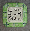 German Ceramic Plate Clock In A Green And Blue Deco Motif With Black Arabic Numbers. Circa 1950'S.