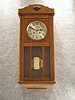 German Box Clock In An Oak Veneered Case. Circa 1910.