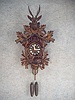 30 Hour Weight Driven German Cuckoo Clock In A Carved Oak Leaf Motif. Circa 1900-1910.