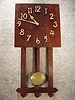 Mission Oak Wall Clock, The "Monterey", In A Dark Oak Case By The Ingraham Clock Co., In Bristol, Ct. Circa 1911-1915