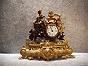 French Spelter Case Mantel Clock With A Man And Grapes Motif. Circa 1885.