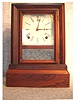 J.C. Brown, Bristol, Ct., 8 Day Time And Strike Cottage Clock. Circa 1850.