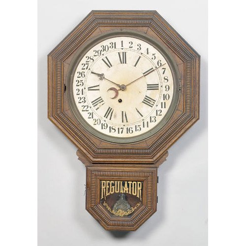 Calendar Clock, an unmarked octagonal oak wall clock with drop with tablet having Regulator and floral scroll in gilt; — Antique Clocks Price Guide