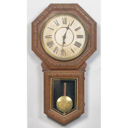 Welch Star Pointer Regulator Wall Clock pressed oak octagonal case in original varnish finish with long drop and gilt edged tablet; printed paper dial with Roman numerals marked Made by E.M. Welsh MFG. Co. Forestville Conn. U.S.A. with printed paper label on rear with model name; 17.5" wide x 4" deep x 32.5" long.From the Estate of John Auraden of Hamilton &amp; Fairhaven, — Antique Clocks Price Guide