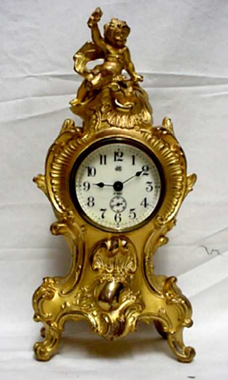 Gold Gilt Jennings Bros. Clock with a Cherub — Antique Clocks Price Guide