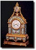 A mantel clock with gilt bronze case and hand painted panel in the SËvres style, c1860