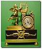 French gilt ormolu and bronze First empire figural mantel clock, circa 1830