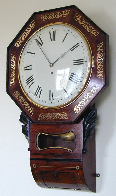 English 8 day octagonal rosewood drop trunk dial clock — Antique Clocks Price Guide