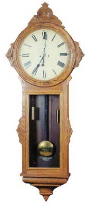 Ansonia Clock Co. "General", ca 1914. Oak case at 68 inches is a mighty big clock, with carved trim on the top and sides. — Antique Clocks Price Guide